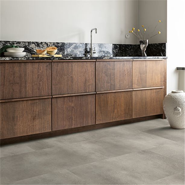 dark brown kitchen with a grey vinyl tile floor